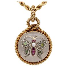 Victorian Marvel A very rare Victorian period locket pendant plus chain – French origin 1860/1880 ca The large locket is of circular shape carved from polished Rock Crystal – nestled into gold hinged lock work with an interlaced rope knotted frame, all of solid 18 Kt gold The high domed Rock Crystal top has a butterfly applied enriched with fine antique gems: Ruby, Natural Pearl, Chrysolite effect against the Rock Crystal gemstone – all in fine condition and perfect order – comes with an antique Victorian Jewelry With Coin Pendant, Victorian Medallion Jewelry With Cabochon, Victorian Jewelry With Cabochon Medallion, Vintage Coin-shaped Intaglio Jewelry, Vintage Coin Intaglio Jewelry, Victorian Round Intaglio Necklace, Victorian Round Intaglio Necklaces, Vintage Intaglio Coin Jewelry, Antique Medallion Intaglio Jewelry