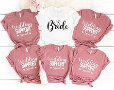 six matching shirts with the words wedding support and bride support on them, sitting next to a flower