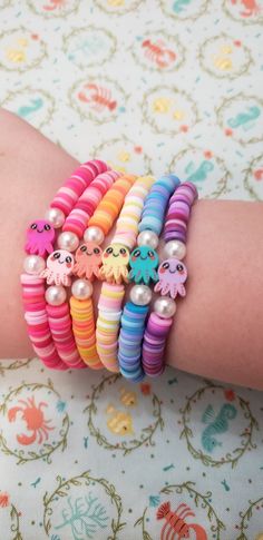 the bracelets are all different colors and have cute little animals on each bead