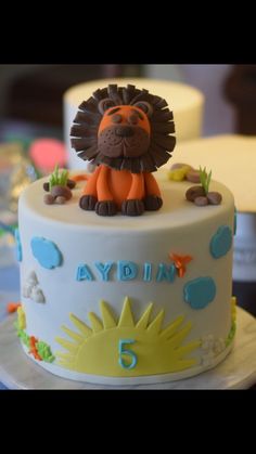 a birthday cake with a lion on top