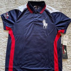 Polo By Ralph Lauren 2008 Us Open Tennis Shirt Authentic Us Open Ballperson Shirt! Condition: New! (Unworn, With Tags) Material: Polyester Size: M Color: Navy/White/Red Happy To Answer Any Questions You May Have! Navy Sporty Shirt For Sports, Red Collared Sports Top, Navy Polo Collar Top For Sports, Navy Short Sleeve Sporty Polo Shirt, Sporty Navy Short Sleeve Polo Shirt, Navy Sporty Shirt With Polo Collar, Sporty Navy Shirt With Polo Collar, Navy Casual Sports Shirt, Casual Navy Sports Shirt