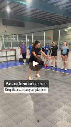 a group of people standing in a gym