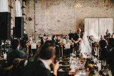 a bride and groom standing at the end of their wedding reception