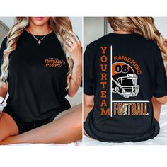 Custom Football Mom Shirt, Personalized Football Shirt, Your Name Football Shirt, Number Shirt, Game Day Tee, Unisex Tee, Football Team ABOUT US: Are you looking for customized soft/lovely/comfy apparels for your loved ones? Then welcome to TXcustomtee Customer service is always our priority. If you have any questions, please feel free to message. HOW TO ORDER: * Select your clothing style, size and color from drop down menus. * Select the quantity. * (If provided for that listing) Add your info Black Tops With Text Print For Football Season, Black Cotton Tops For Football Season, Black Cotton Tops For Football, Football Season Graphic Print Crew Neck Shirt, Short Sleeve Tops With Football Theme Text, Short Sleeve Tops With Text Print For Football Season, Black Team Spirit Shirt For Football Season, Black Long Sleeve Shirt With Name Print, Pre-shrunk Black Shirt For Football Season