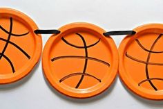 three paper plates with basketballs drawn on them