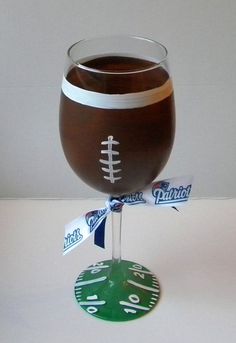 a wine glass with a football on it