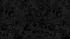 black and white wallpaper with lots of different stickers on it's surface