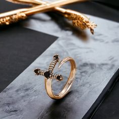 Why Us? 🌸   Free & Fast Shipping 📦 30-Day Moneyback Guarantee ✔️ Elegant & Aesthetic ⭐ Beautiful Japanese Atmosphere 🌠 Introducing our Mesmerizing Japanese Sword Ring ⚔️💍. This captivating piece pays homage to the artistry of Japanese swords, combining elegance with a touch of the extraordinary. The intricate detailing on the ring captures the essence of craftsmanship, making it a unique and mesmerizing accessory. Elevate your style with the symbolic power and grace of our Mesmerizing Japanese Sword Ring. ⚔️💍✨ Creative Rings Unique, Mdzs Ring, Japanese Ring, Minimalistic Ring, Adventure Crafts, Runners Outfit, Japanese Swords, Japanese Jewelry, Elegant Aesthetic