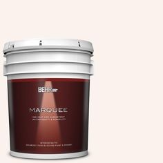 a bucket of marquee paint on a peach colored background with the words behrf marquee