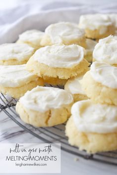 cookies with white frosting on a cooling rack