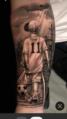 a man's arm with a tattoo on it that has an image of a soccer player