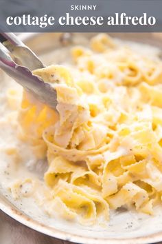 a bowl filled with pasta and cheese on top of a table