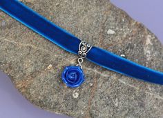 "Blue velvet ribbon choker with sculpted cobalt blue rose. Rose material is polymer clay with the special pearl cover. Each petal of flower made by hand without any mold Dia flower 13-15 mm/ 0.45-0.55 \" Length of necklace is adjustable: 10-12 inches/ 25,4 - 30,5 cm 11-13 inches/ 28-33 cm 12-14 inches/ 30.5- 35.5 cm 13-15 inches/ 33-38 cm 14-16 inches/ 35.5 cm-40.5 cm 15-17 inches/ 38,1 cm- 43,2 cm 16-18 inches/ 40.6 cm- 45.7 cm 17-19 inches/ 43 cm - 48 cm 18-20 inches/ 45,7 - 50,8 cm Τhe length Blue Choker As A Gift, Indigo Necklace, Blue Velvet Ribbon, Navy Blue Earrings, Rose Choker, Ribbon Choker, Dragon Earrings, Chocker Necklace, Flower Choker