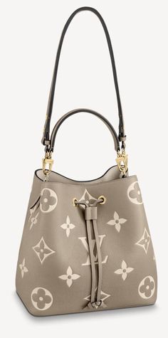 Brand New Louis Vuitton Neonoe in Creme/ Dove. Comes with pouch, box and dust bag. Guaranteed Authentic! “The bold LV Initials and Monogram Flowers bring a fashionable feel to this NéoNoé MM bucket bag. The motif is first printed on the leather then embossed to enhance the hypnotic effect. This versatile bag can be worn cross-body or over the shoulder, thanks to its adjustable strap. Inside, a zipped pocket keeps valuables secure. Detailed Features 10.2 x 10.2 x 6.9 inches (length x Height x Width) Tourterelle Gray/Cream Embossed grained cowhide leather Grained cowhide-leather trim Microfiber lining Gold-color hardware Zipped central pocket 2 compartments Metal eyelets Strap:Removable, adjustable Strap drop: 12.2 inches Strap drop max: 21.3 inches Handle:Single, removable” NDC455551 Dove Cream, Néonoé Mm, Lv Neonoe, Louis Vuitton Neonoe, Lv Bag, Cowhide Leather, Bucket Bag, Bags Handbags, Dust Bag