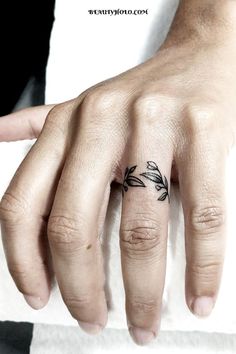 Wedding Ring Tattoos: A Timeless Symbol of Everlasting Love. Explore unique designs and meaningful expressions of commitment. Find inspiration for your own ring tattoo here. #weddingringtattoos #lovesymbol #ringtattoos Marriage Ring Tattoos, Toe Ring Tattoos, Pinky Tattoo, Wedding Ring Finger Tattoos, Wedding Ring Tattoos, Marriage Tattoos, Ring Tattoo Designs, Love Symbol Tattoos, Wedding Band Tattoo