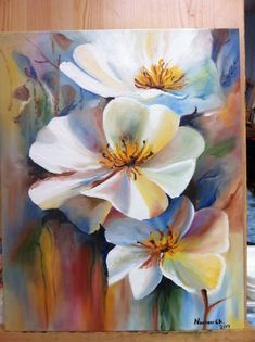 an acrylic painting of three white flowers