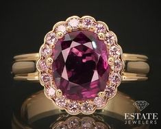 Stunning gold ring with a VIVID newly mounted natural 9.1mm by 7.2mm pink sapphire with .36ctw of round cut fancy colored natural pink diamonds. Rare combo and color of stones! VS2-SI clarity. 13mm tall face. stamped 18k SIZE-7 Gia Certified Pink Sapphire Rings For Formal Occasions, Gia Certified Luxury Pink Ruby Ring, Luxury Pink Sapphire Ring With Halo Setting, Gia Certified Pink Diamond Ruby Ring, Gia Certified Oval Pink Ruby Ring, Luxury Gia Certified Pink Sapphire Ring, Gia Certified Fine Jewelry Pink Sapphire Diamond Ring, Fine Jewelry Gia Certified Pink Sapphire Diamond Ring, Gia Certified Classic Pink Sapphire Jewelry