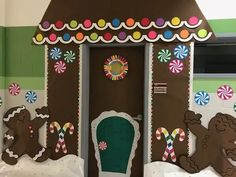 a door decorated with gingerbread cookies and candy canes