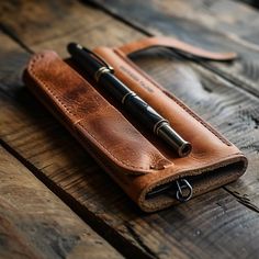 These pencil cases are the perfect blend of style and functionality, making them an essential accessory for anyone who loves stationery. Classic Rectangular Pencil Case For Everyday Use, Classic Rectangular Pencil Case, Leather Cases With Pen Slots For Daily Use, Leather Organizer With Pen Slots For Business, Leather Business Organizer With Pen Slots, Rectangular Stationery With Pen Slots For Everyday Use, Leather Rectangular Pencil Case, Modern Pencil Case With Pen Holders For Personal Use, Rectangular Case Stationery With Pen Slots For Everyday Use