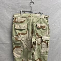 Medium-Short / Vintage Desert Camouflage Tan Cargo Combat Military Pants Waist: 31"-35" Adjustable // Inseam: 27"-30" Adjustable // Rise: 11in Fourth slide shows tassles on bottom to adjust inseam. Waist is adjustable via cinch straps on hips. Desert Camouflage, Vintage Desert, Military Pants, Camouflage, Favorite Outfit, Adult Outfits, Bathing Beauties, Display Homes, Gender Neutral