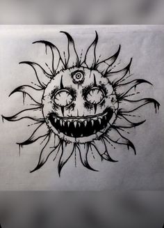 a drawing of a smiling sun with big eyes and sharp fangs on it's face