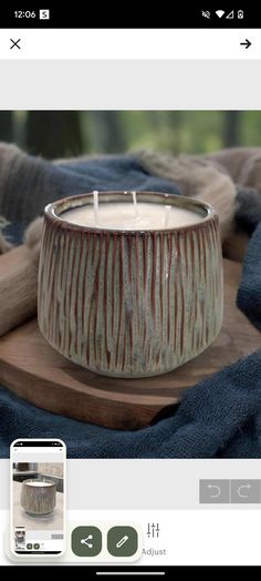 a candle sitting on top of a wooden table