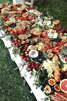 a long table covered in lots of different types of food