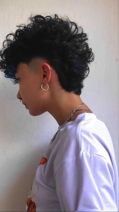 Trends of Today. Punk Hairstyles For Curly Hair, Curly Mohawk Mullet, Queer Mullet Curly, Modern Mohawk For Women, Mohawk Hairstyle Women, Queer Haircut Curly, Short Curly Hair With Undercut, Short Curly Mullet Women, Curly Undercut Women