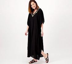 Luxurious and soft, with a stunning amount of hand-beaded and embroidered embellishments, this stunning caftan will take you from lounge to lunch in an instant. From America & Beyond. Spring Embellished Kaftan, Embroidered Summer Loungewear Dresses, Elegant Summer Tunic With Embroidered Neckline, Elegant Embroidered Neckline Tunic For Summer, Spring Embellished Tunic Kaftan, Maxi Kaftan With Embroidered Neckline, Spring Embellished Tunic, Elegant Embroidered Kaftan For Vacation, Traditional Embellished Dresses For Vacation