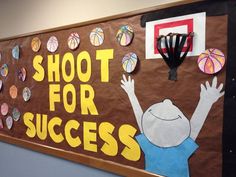 a bulletin board with an image of a basketball player and the words shoot for success