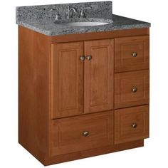 a bathroom vanity with granite counter top and wooden cabinetry on the bottom, against a white background