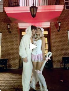 two people in bunny costumes standing next to each other