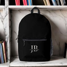 A classic elegant look in black and ivory beige, this custom backpack makes a wonderful gift or treat for yourself. It has large monogram initials to personalize with your desired initials and also the name spelled out in elegant serif type face. It makes a great choice for carrying your things to work, school, or for hiking, camping, and overnight or weekend getaways. Monogrammed Towels, Printed Backpack, Type Face, Elegant Monogram, Custom Backpack, Monogram Towels, Classic Elegant, Monogram Initials, Weekend Getaways