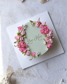 a mother's day card with pink flowers and the words love mom on it