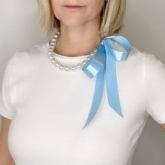 Chunky Pearl Ribbon Necklace * Light Blue Satin Ribbon Tie Pearl Necklace Things I used:  * large white pearls  * light blue satin ribbon tie  Why You'll Love It: * length, adjustable  * lightweight (even though it looks heavy!)   * wear four different ways * hangs beautifully and pearls shine nicely   * perfect for gifting  * perfectly suited for any event or wedding - from the mother of the bride to bridesmaid to bride, and to guest!  * handmade with love in Drumbo, Ontario, Canada  Your item Ribbon Necklace Diy, Pearl Ribbon, Light Blue Ribbon, Chunky Pearls, Tie Necklace, Ribbon Necklace, Black Gift Boxes, Ribbon Tie, Green Satin