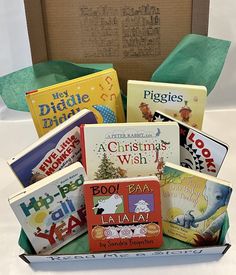 a box filled with lots of books sitting on top of a table