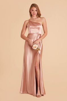 This ultra modern one-shoulder satin bridesmaid dress is the picture of 21st century elegance. Satin Bridesmaids Gowns, Cream Bridesmaid Dresses, Rose Gold Bridesmaid Dress, Rose Bridesmaid Dress, Mauve Bridesmaid, Jennifer Dress, Mauve Bridesmaid Dress, Apricot Dress, Rose Gold Bridesmaid