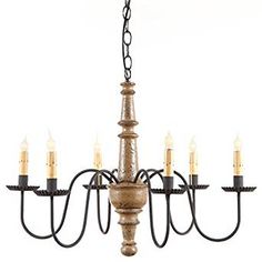 a chandelier with six candles hanging from it