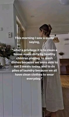 a woman standing in front of a kitchen counter