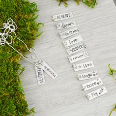 "Great daily inspiration, this necklace features up to 3 charms. Each charm is hand crafted and stamped with your choice of inspirational word or phrase. And it's perfect for layering! The Details *Handcrafted using sterling silver *The charms measure 3/4\" x 1/4\" *Please specify your preferred charm(s) in the \"notes to seller\" box at checkout. The Process Hand stamping is a very different process than traditional engraving. Hand stamping is done entirely by hand, with a hammer and steel stam Everyday Stamped Charm Necklace For Mother's Day, Stamped Charm Necklace For Mother's Day, Inspirational Nickel-free Charm Necklace For Mother's Day, Silver Hand Stamped Meaningful Charm Necklace, Everyday Inspirational Hand Stamped Necklace, Everyday Inspirational Hand Stamped Necklaces, Inspirational Hand Stamped Everyday Necklace, Meaningful Stamped Necklaces For Everyday, Meaningful Hand Stamped Sterling Silver Charm Necklace