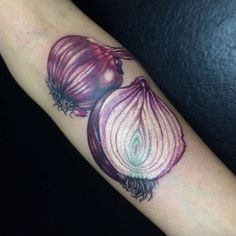 an onion tattoo on the arm