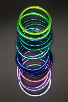 several different colored rings are stacked on top of each other