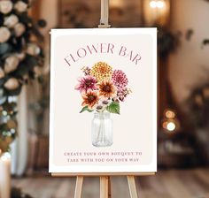 a sign with flowers in a mason jar on it that says, flower bar create your own bouquet to take with you on your way