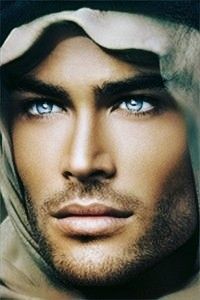 a man with blue eyes wearing a hooded jacket