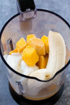 a blender filled with fruit and ice cream