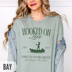 Make your next girls' trip, bachelorette party, or birthday celebration extra special with this custom fishing shirt. It's the perfect personalized gift or party favor! Personalization:  All text on the design can be customized. Input your requests in the personalization box. A proof will be sent within 24 hours of ordering for approval prior to printing.  Shirt Details: Unisex crewneck shirt with a relaxed fit. Made of a soft-washed, garment-dyed medium fabric of 100% cotton. Comfort and durabi Fishing Themed Bachelorette Party, Fishing Bachelorette Party, River Bachelorette Party, Lake Bachelorette Party, Lake Bachelorette, Friends Bachelorette, Outdoorsy Girl, Lake Party, Fishing Wedding