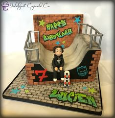 a cake made to look like a skateboarder is sitting on the ramp with his board