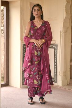 Wine red hand woven chanderi silk kurta with floral print, V neck and high side slits. Paired with printed pants and chiffon floral border dupatta.
Component: 3
Pattern: Printed
Type Of Work: Floral Print
Neckline: V Neck
Sleeve Type: Sleeveless
Fabric: Chanderi Silk, Dupatta: Chiffon
Color: Wine
Other Details: 
Side slits on kurta
Closure:
Kurta: Back concealed zip
Occasion: Work,Puja - Aza Fashions Red Kurta Set, Chanderi Silk Suits, Silk Kurta Set, Sleeveless Kurta, Red Kurta, Kurta Set For Women, Handloom Fabric, Silk Kurta, Creative Lifestyle