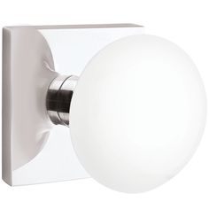 a white ball mounted on the side of a light fixture with a black handle and round glass globe