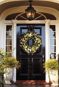 a front door with a wreath on it